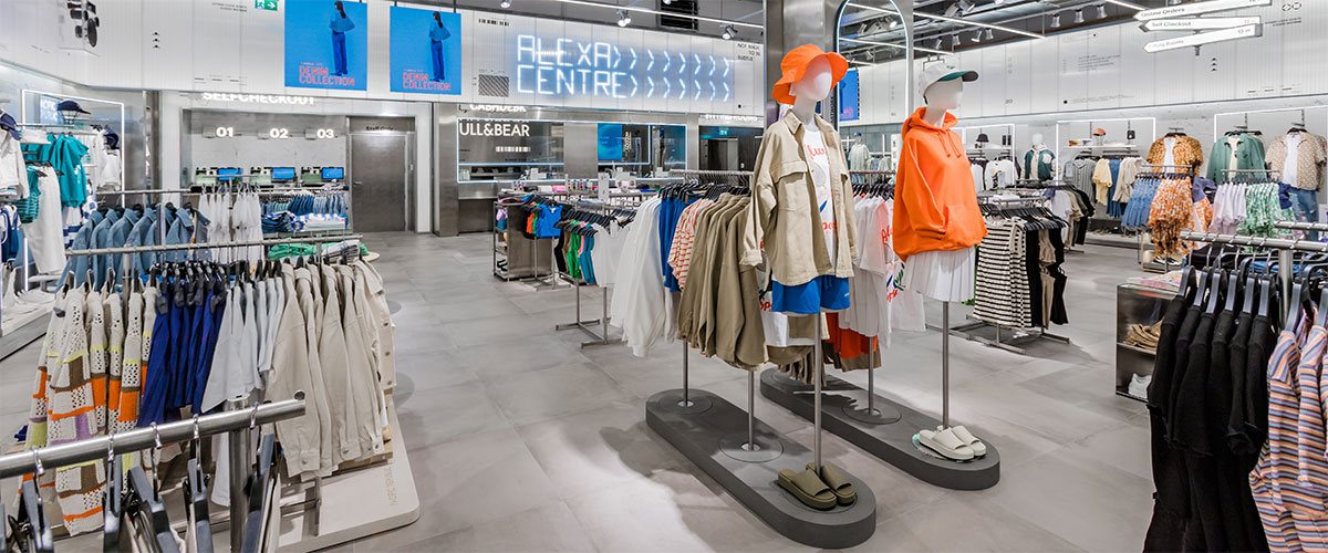 "Pull&Bear UK 2025 fashion collection with models showcasing modern streetwear, denim, and youth-focused apparel in a colorful studio setting."